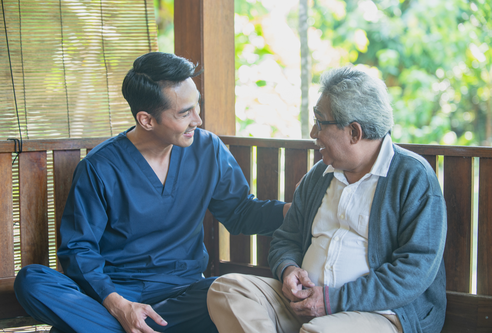 Care professional speaking with an adult respite guest